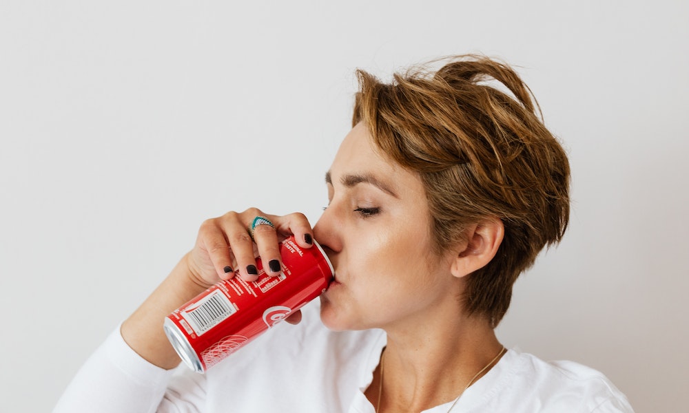 Woman drinking a soda