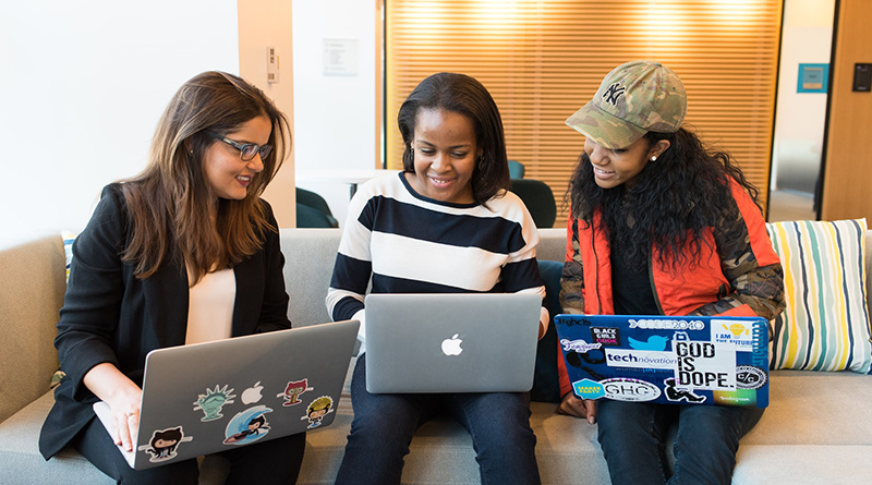 Diverse group of women working on their laptops