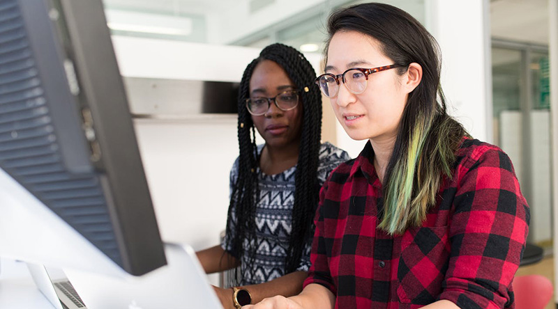 Two data analysts working