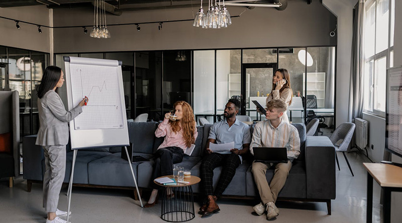 A woman describing a graph to her team