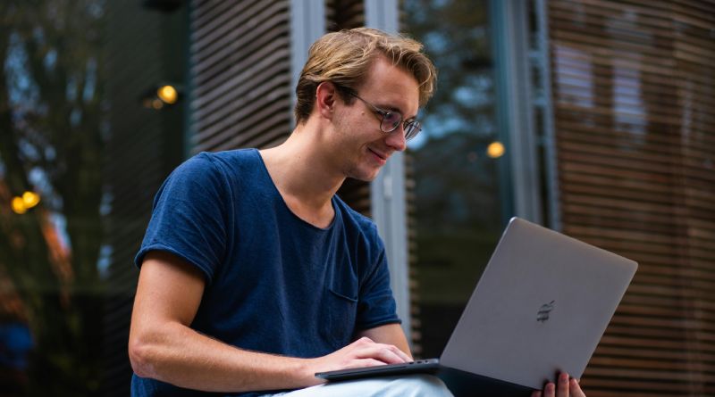 A man looking at his laptop