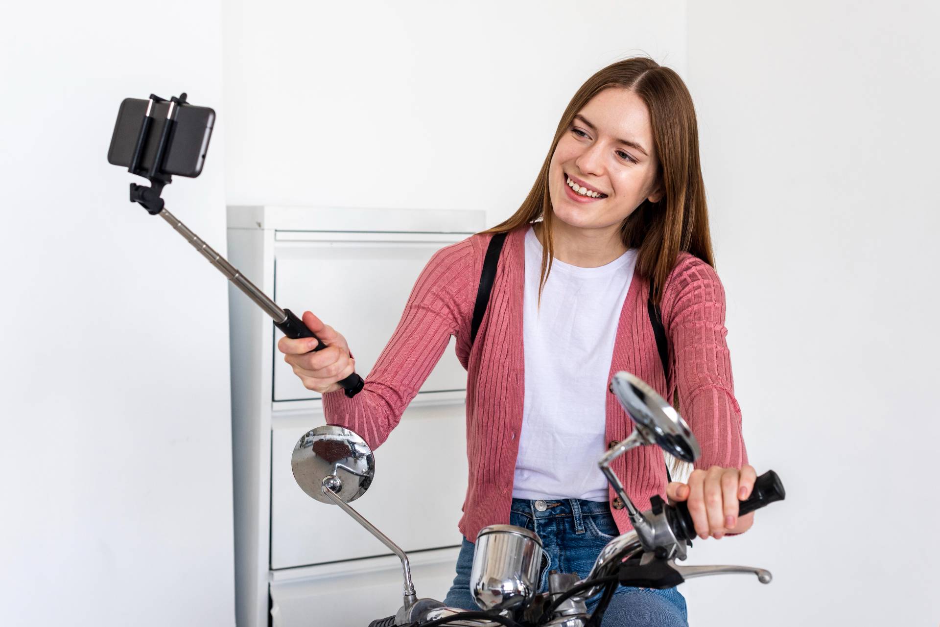 Woman Taxing Herself On A Motorcycle